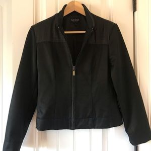 Gucci black jacket with elbow/shoulder detail.